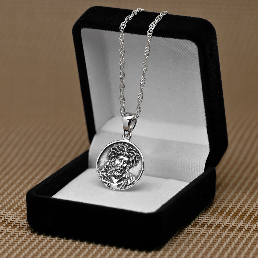 Colgante rostro de cristo con corona de espinas en plata 925